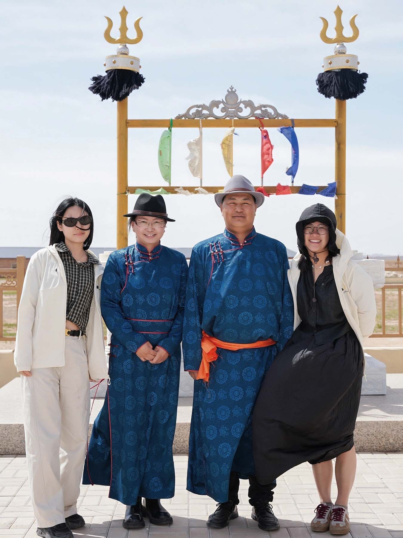 two girls with two people dress in mongolia clothes